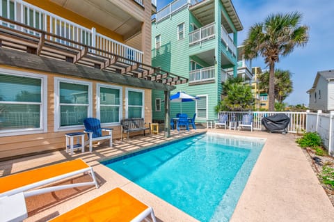 Your private pool awaits with comfortable loungers and a covered patio where you can relax in the shade of swaying palm trees.