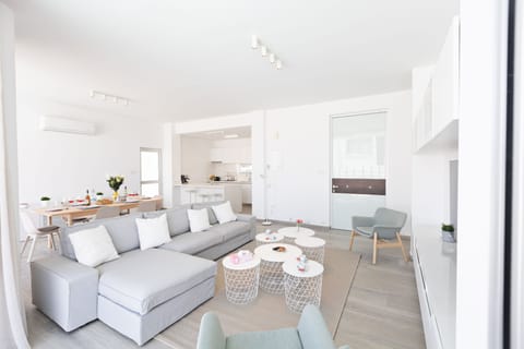 Living room with comfortable corner sofa and widescreen TV