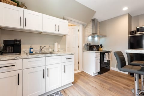 This kitchen is perfect for cooking and entertaining guests.