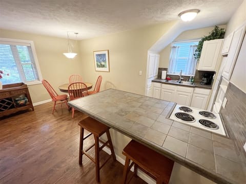 Kitchen dining area with snack bar seating for two