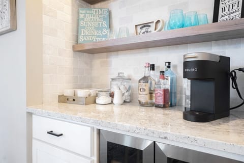 The coffee/bar area has a wine cooler