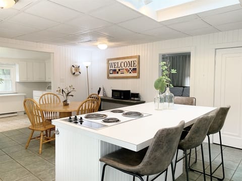 Center work island has a snack bar with seating for four