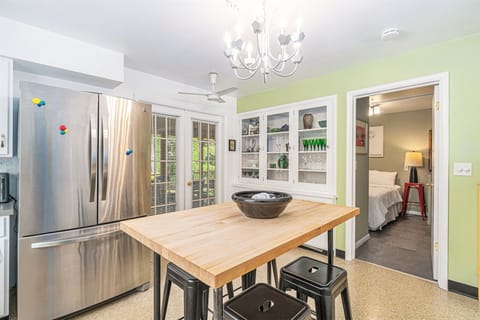 Doors from the kitchen lead out to the screen porch