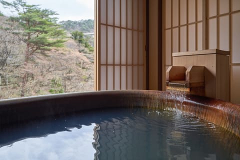 Twin Room, Non Smoking (with private open-air bath) | Bathroom | Designer toiletries, hair dryer, slippers, towels
