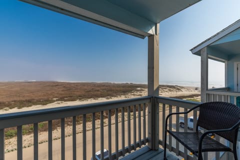 Sweeping coastal views stretch endlessly from your private covered balcony, where morning coffee tastes better with ocean breezes and endless horizons.