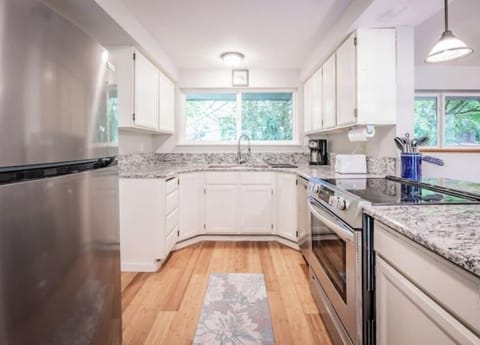 Newly remodeled kitchen with granite countertops and new stainless appliances. 
