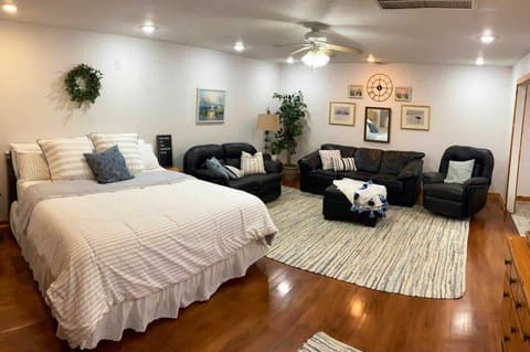 Super comfy King bed, with leather sofa, love seat and rocker; plus three twin size deluxe blow up mattresses, sheets, blankets, pillows, etc.