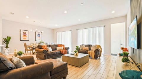 Spacious open-concept living and dining with stylish decor and natural light.
