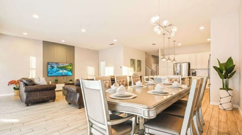 Stylish open-concept kitchen, dining, and living area perfect for group stays.
