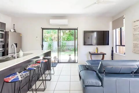 Large kitchen/lounge with 70" Smart TV. Private fully-fenced yard 