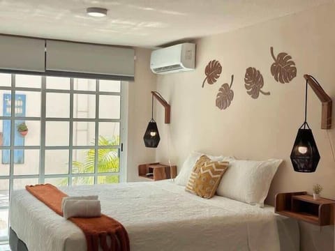 Comfortable double bed with boutique wall decor