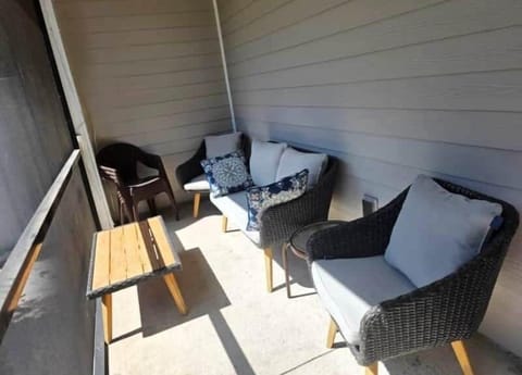 Relax and have your morning coffee in this sunny screened-in patio