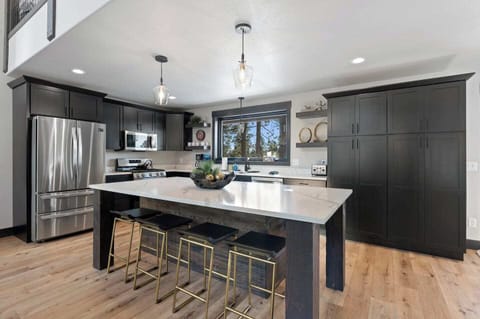 Kitchen island with bar seating, plenty of room to prep and gather. 