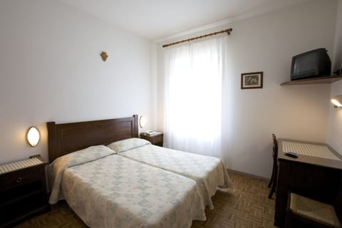 Desk, laptop workspace, blackout drapes, iron/ironing board