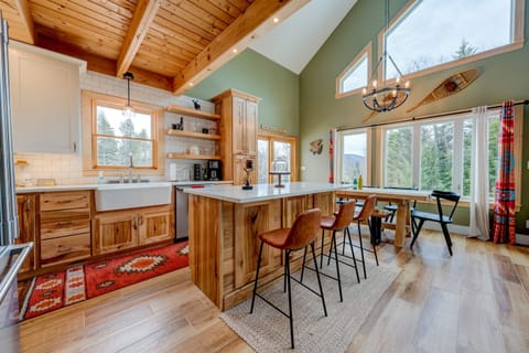 Kitchen Island with seating for 4.  4th chair is in the closet.