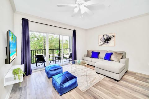 Inviting living room with smart TV and direct patio access 