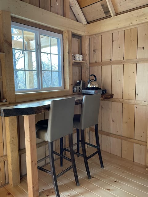 Inside Table for two.  Place settings / silverware provided.