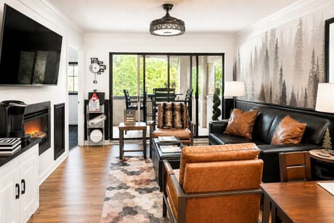 Cozy up in our stylish living room, then step through the sliding glass doors to your private patio for fresh mountain air and al fresco dining