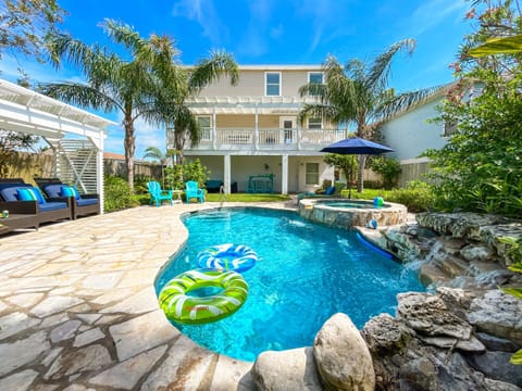 Backyard Oasis: Dive into fun with a sparkling pool and vibrant lounging areas!