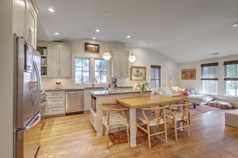 Spacious open-plan kitchen and dining area for shared meals and gatherings.