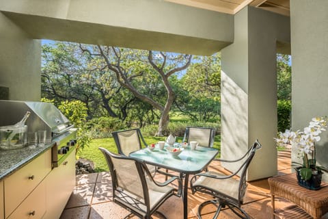 Start your day soaking up the morning light on your private lanai, surrounded by lush trees and serene greenbelt views.