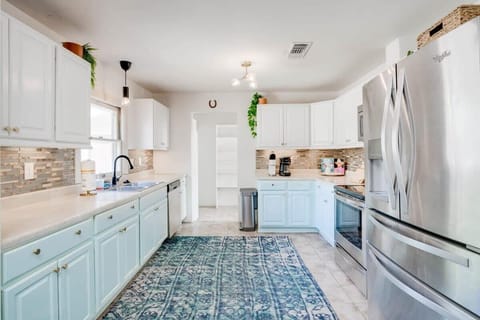 Kitchen w stocked cooking utensils and pans / pots / plateware