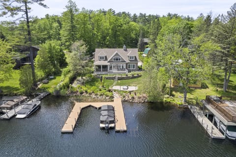 Lakeside view of the home. This home has dockspace for 3 boats up to 30' long. 