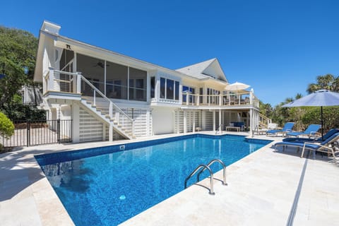 Welcome to No More Cloudy Days, a stunning oceanfront getaway with a sparkling private pool and direct beach access