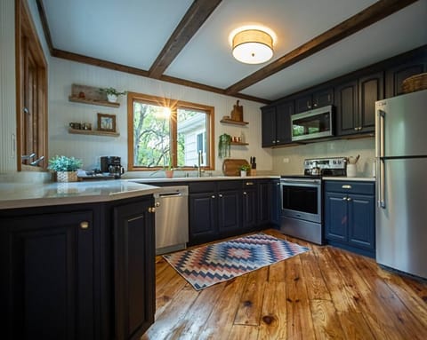 Prepare your favorite meals in this redesigned kitchen, with quartz counter tops and all new appliances.