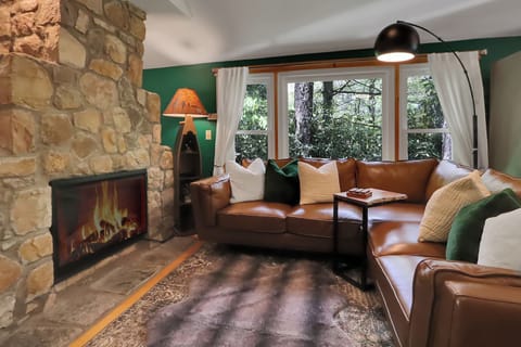 Enjoy comfort on a crisp mountain evening by the stone fireplace.