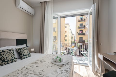 Deluxe Room, 1 Queen Bed, Balcony, City View | Desk, laptop workspace, WiFi (free), individually decorated