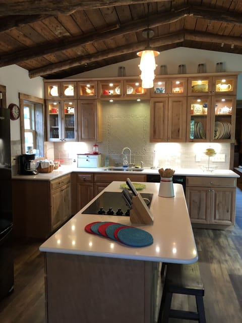 Fully stocked kitchen with cookware, plates/bowls, flatware, glassware, etc.