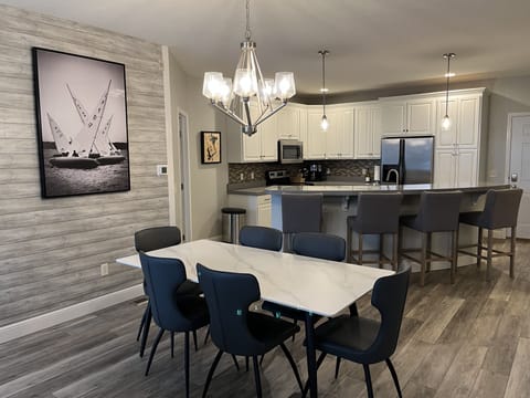 Friends and family gather around — comfortable dining for 10.