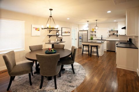 Our kitchen features ample seating for everyone to enjoy a meal together, and with a 65-inch TV, you won`t have to miss a moment of the game or your favorite show while you cook.