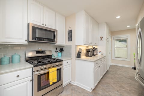 The kitchen boasts ample cabinet space