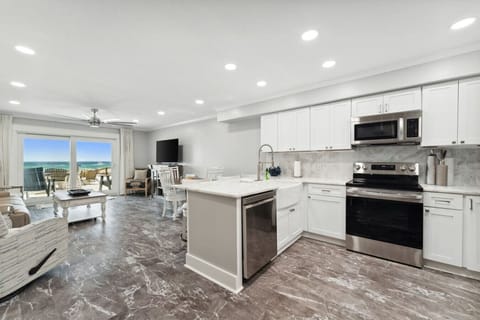 Living Area with Flat Screen TV plus Fully Equipped Kitchen