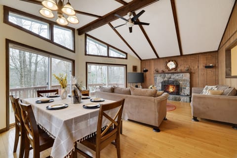 Dining room table centrally located. You can enjoy the view outside, TV, or fireplace! 