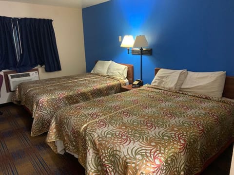 Economy Quadruple Room, 2 Queen Beds, Non Smoking | Individually decorated, individually furnished, free WiFi, bed sheets