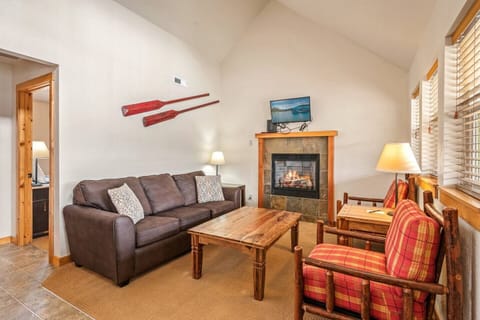 Spacious living area with a warm gas insert fireplace.