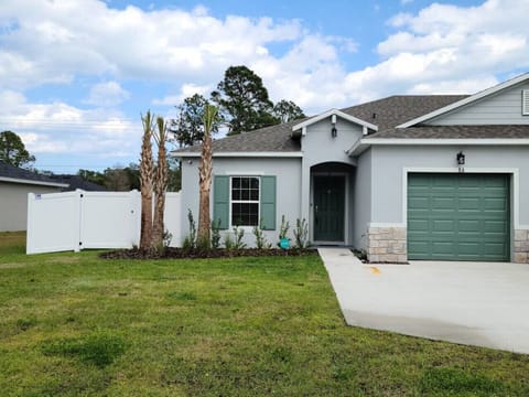 Beautiful landscaping in front of house.