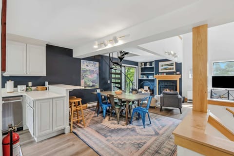 Living & Dining Area — Navy Accent Wall, Fireplace & Kitchen