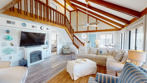 An airy, light-filled retreat with vaulted ceilings, warm wood accents, and relaxed coastal charm—perfect for unwinding after a day in Myrtle Beach.