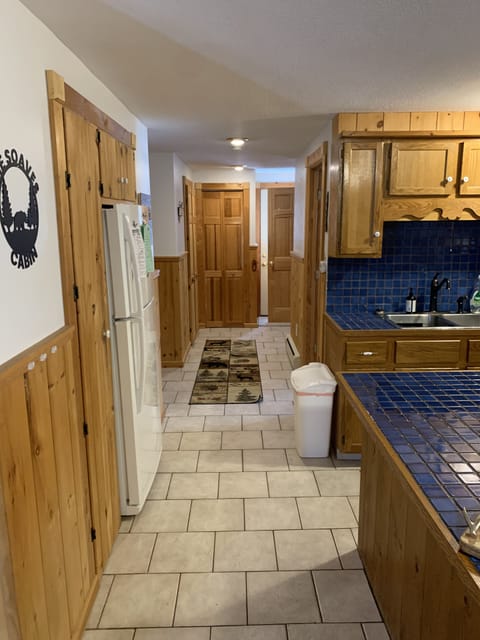 Hallway heading to lower level guest room, bathroom and laundry room