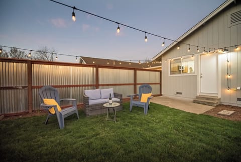 Open and incredible backyard with bistro lights