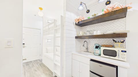 Kitchenette with basic dining and coffee essentials