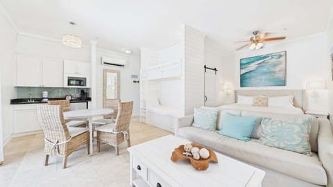 Stylish living area with couch and huge TV