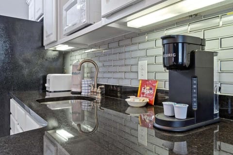 Kitchenette with seating area and full size refrigerator