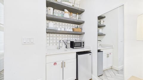 Kitchenette with microwave and under counter refrigerator