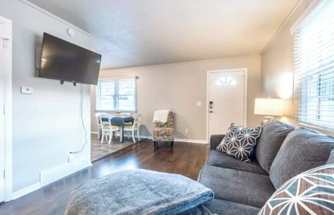 Experience the ultimate in-home entertainment with our luxurious gray sofa and the immersive 55-inch TV.  ️✨