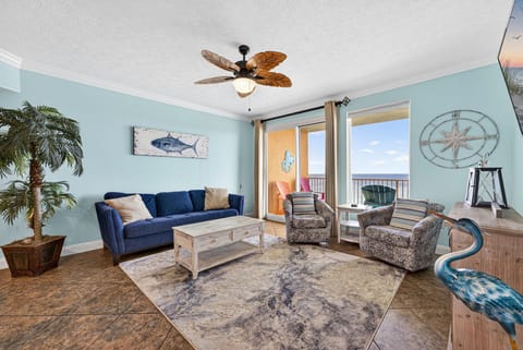 Relax in this coastal-themed living room with ocean views and comfortable seating.